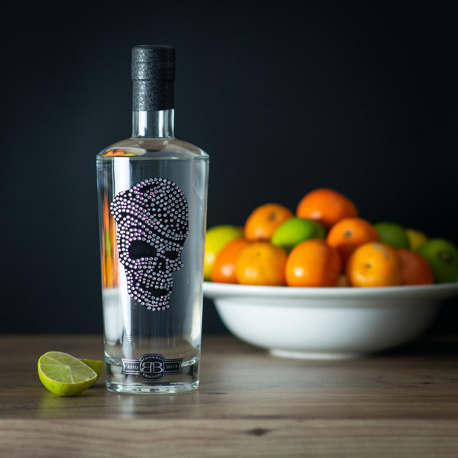 Bottle of the best vodka in the UK with a large fruit bowl at the background